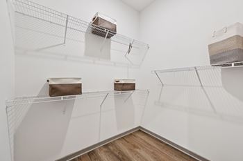 A white room with shelves and boxes on them at The Hadley - North Port, FL Apartments, North Port, FL, 34287